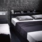 Assembly and installation included. Black single bed with storage. Black bed. Storage shelf. Outlet. Bed frame. Hotel. Mattress included. Single.